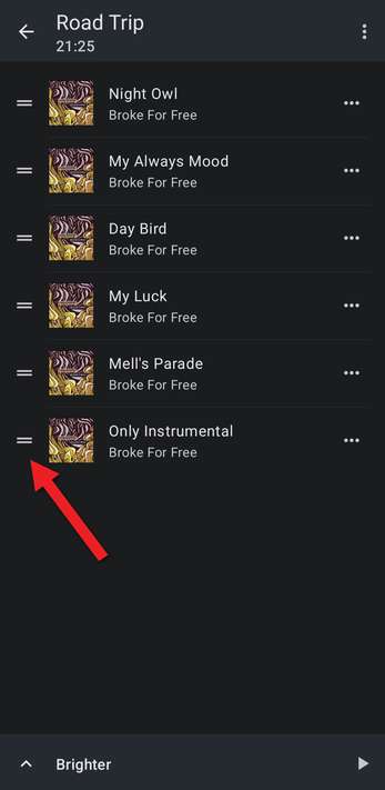 Playlist with an arrow pointing at a drag handle