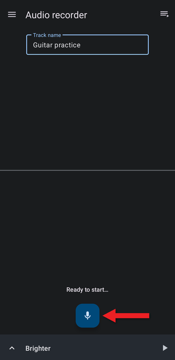 Arrow pointing at the microphone button