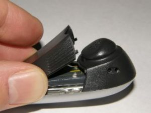 Plantronics CS50 showing battery door pried open