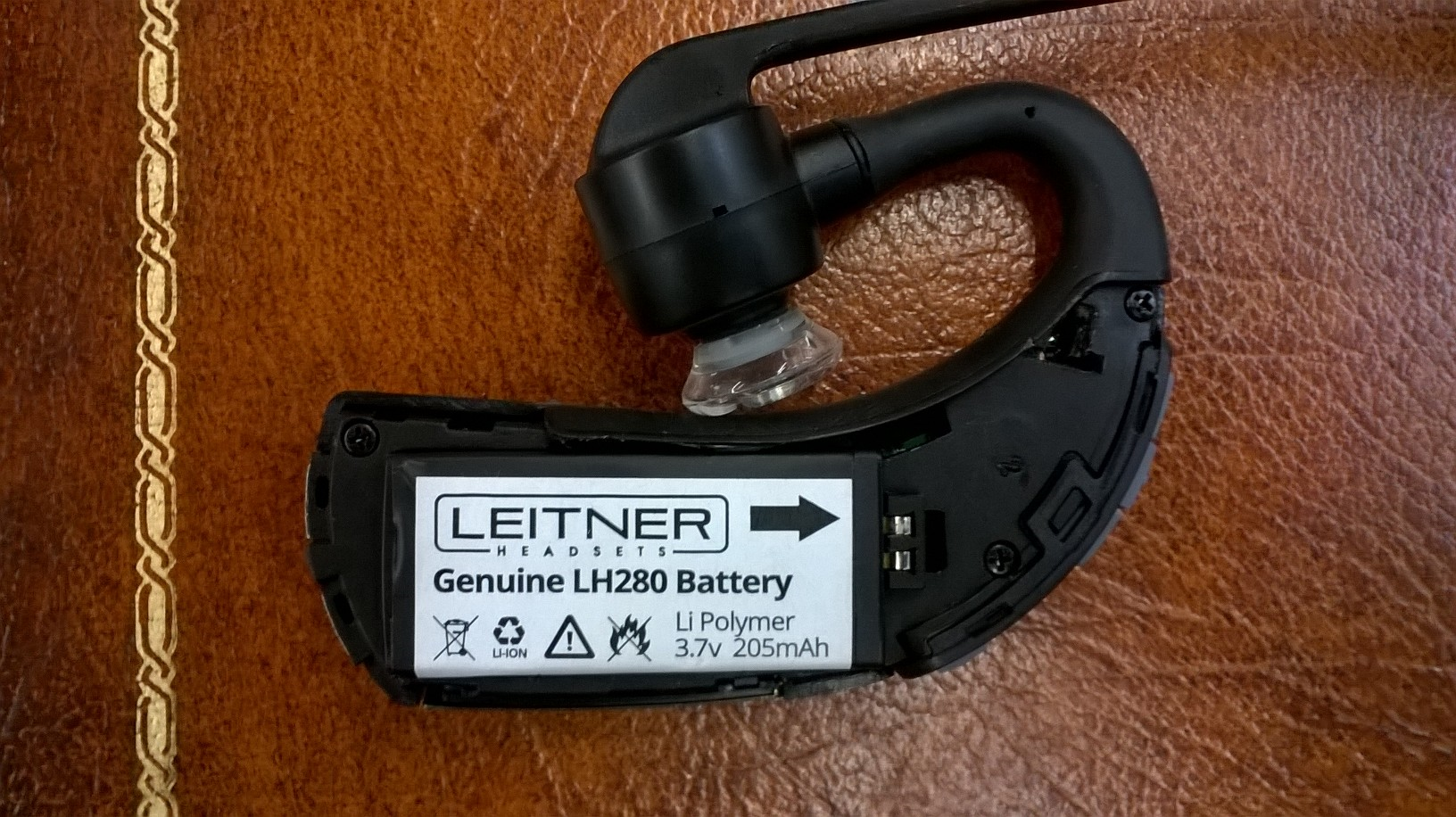Leitner LH280 with battery door open, exposing headset battery
