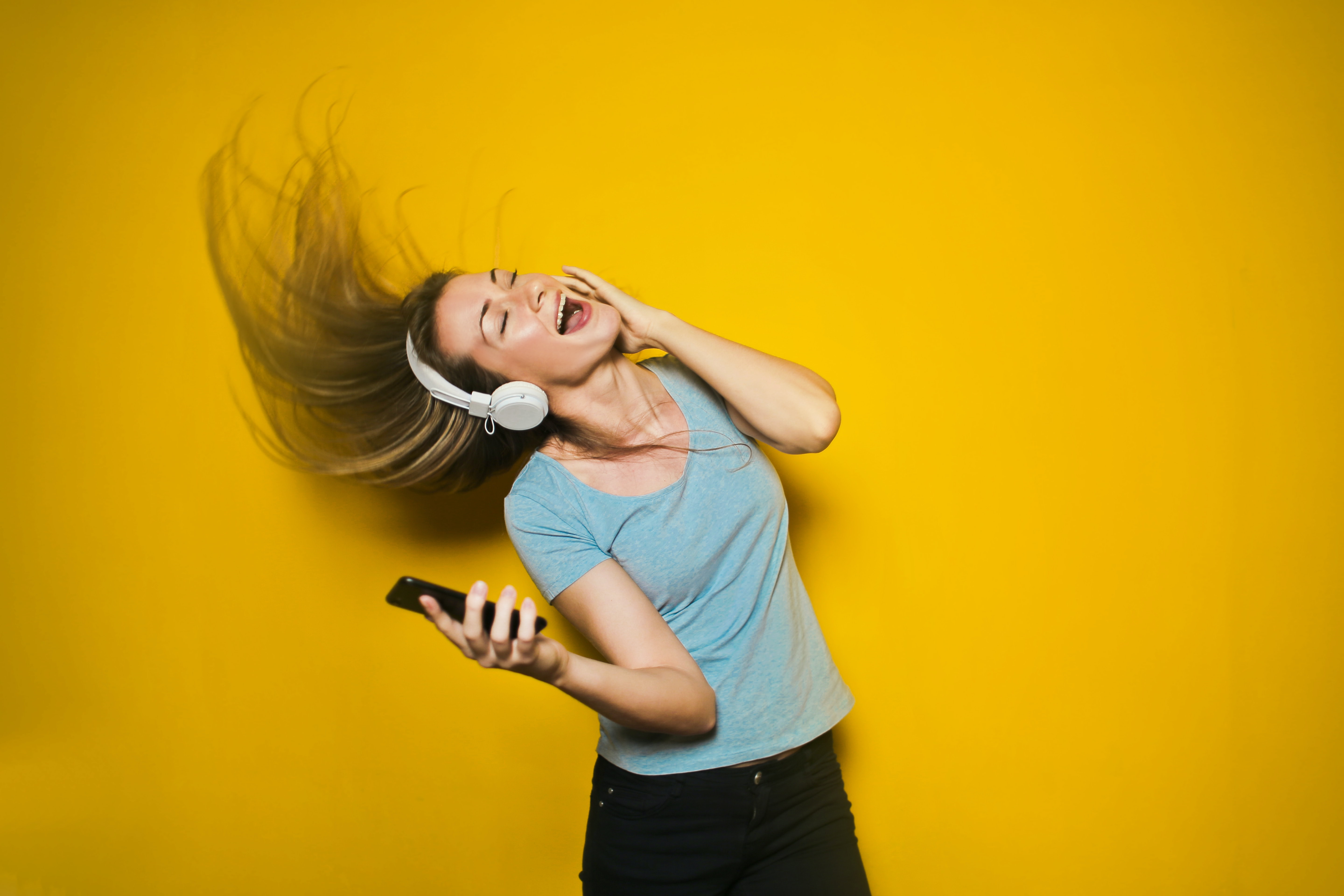 Woman listen to music on Bluetooth headset